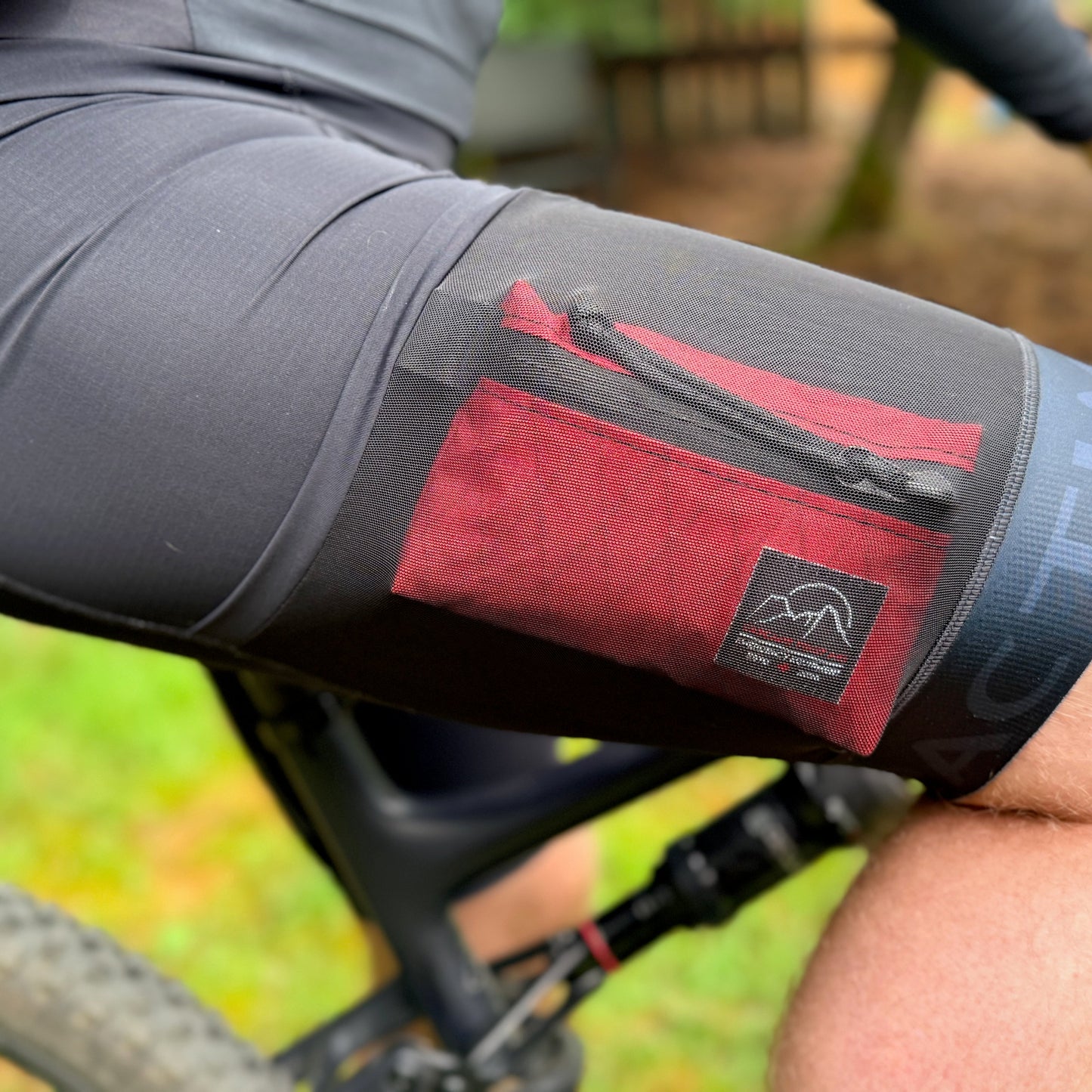 Close-up of The Grindy Gravel & XC First Aid Kit inside bib shorts - at under 4oz, the kit is barely noticeable | Cascade First Aid