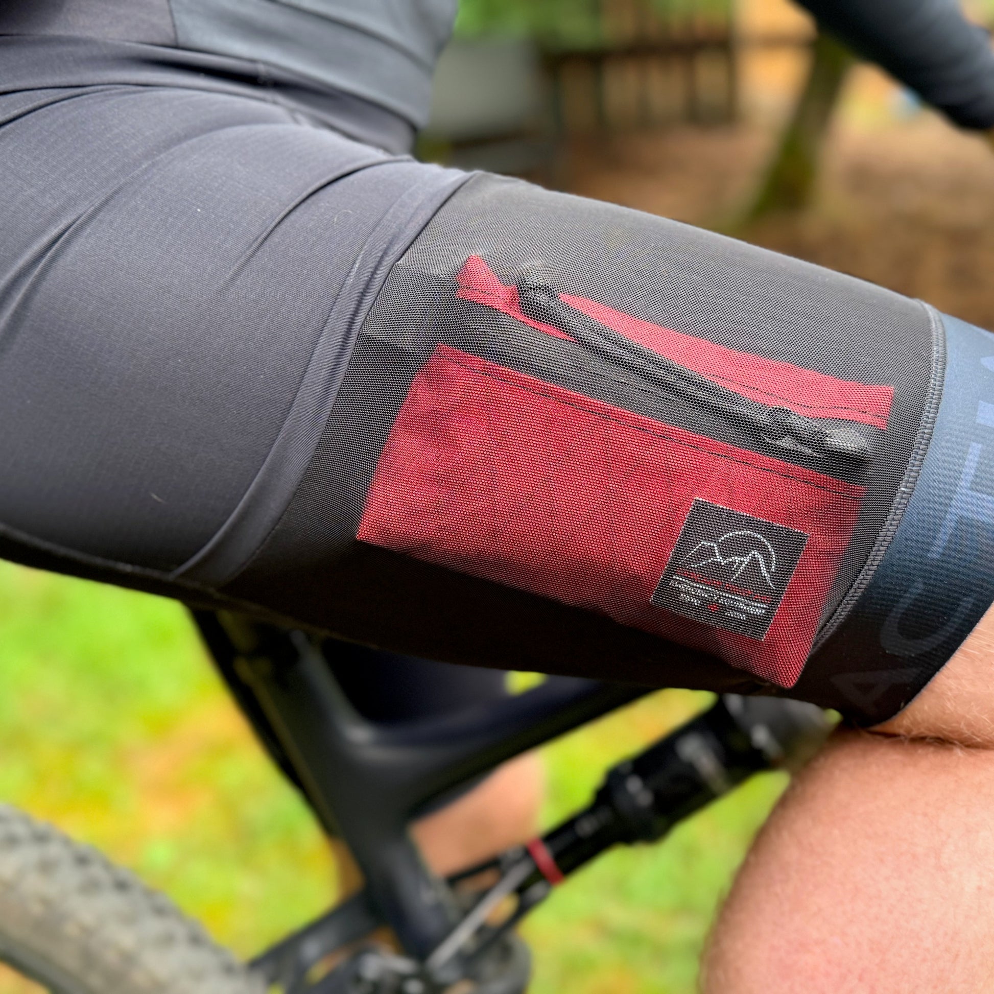 Close-up of The Grindy Gravel & XC First Aid Kit inside bib shorts - at under 4oz, the kit is barely noticeable | Cascade First Aid