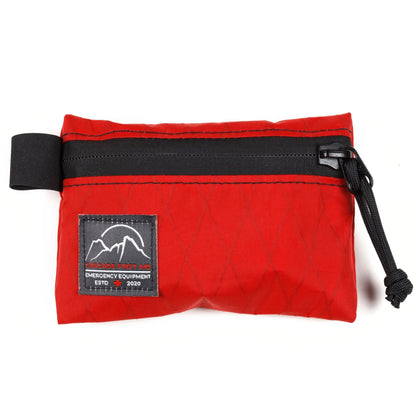 Red Bits Bag - smaller than a 4x6" postcard and fits easily into a running vest, jersey pocket, or anywhere else you need to stash a first aid kit | Cascade First Aid